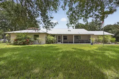 17183 73rd Ct N, The Acreage: photo 1 of 100