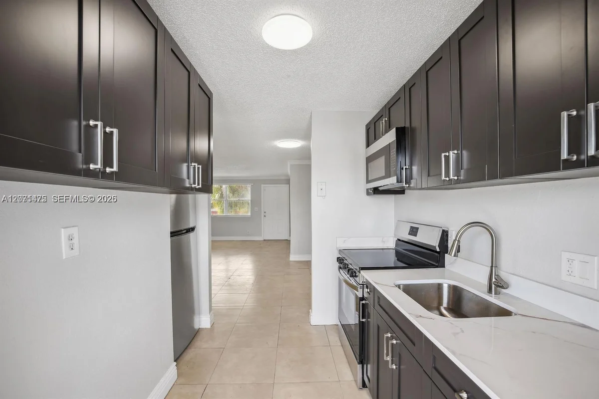 850 E Commercial Blvd #214B, Oakland Park: photo 1 of 19