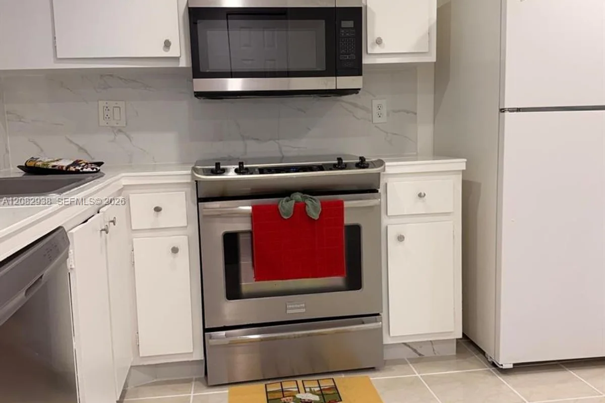 6575 W Oakland Park Blvd #303, Lauderhill: photo 1 of 24