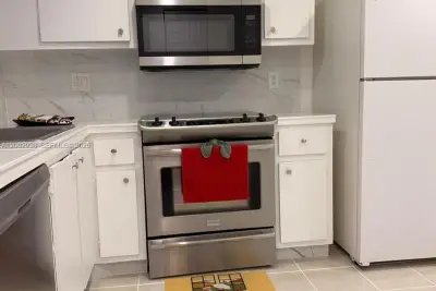 6575 W Oakland Park Blvd #303, Lauderhill: photo 1 of 24