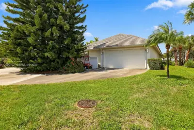 173 Orange Tree Dr, Atlantis: photo 1 of 57