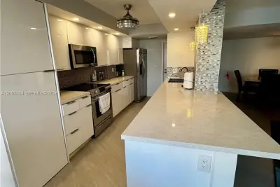 100 Golden Isles Dr #205, Hallandale Beach: photo 1 of 35